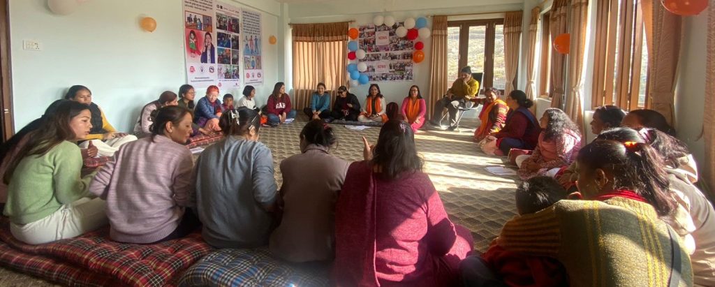 participants sitting round in the floor