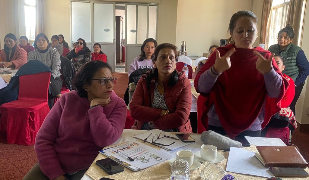 Rasmi amatya delivering her comment on the report