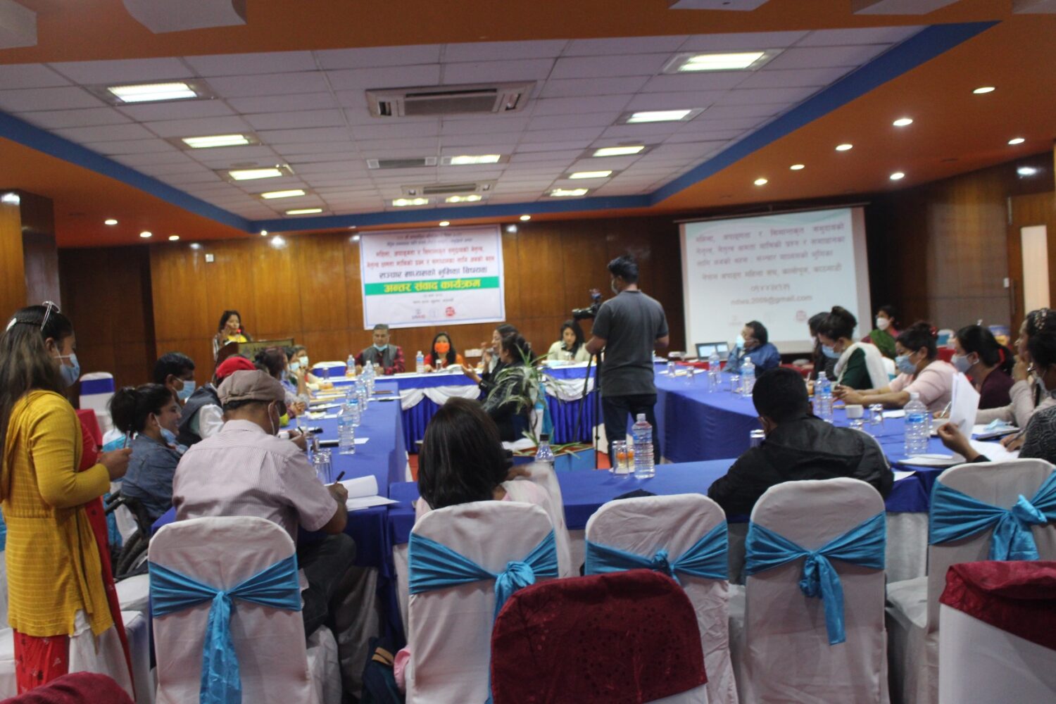 It is a event setting where the people are sitting in U-setting.