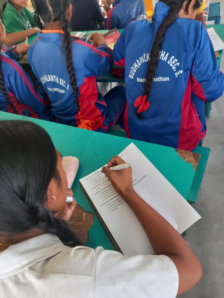 An adolescent girl filling pre-test questionnaire during session in disability and gender-based violence.